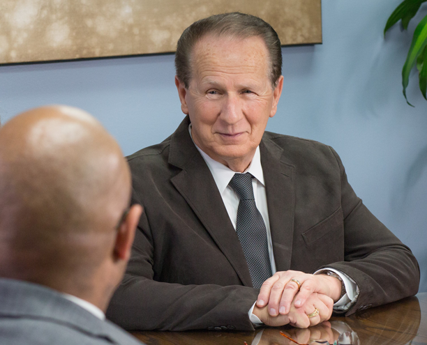 Photo of Donald R. Holben Talking To His Client